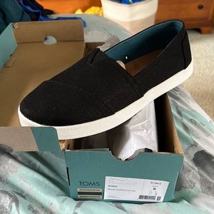 Brand New in the Box Toms Black Canvas Shoes. Size 9